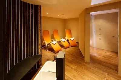 Ein Sitzbereich in der Unterkunft Hotel Messmer