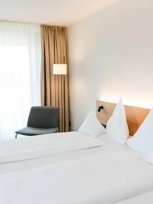Ein Bett oder Betten in einem Zimmer der Unterkunft Hotel Krone