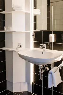 Ein Badezimmer in der Unterkunft Hotel Krone