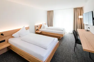 Ein Bett oder Betten in einem Zimmer der Unterkunft Hotel Krone