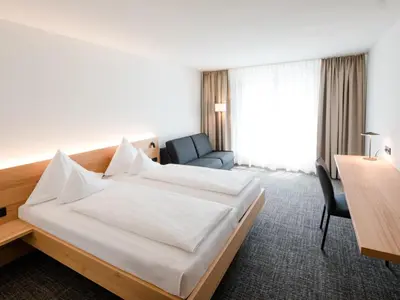 Ein Bett oder Betten in einem Zimmer der Unterkunft Hotel Krone