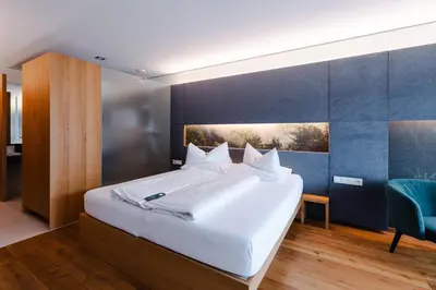 Ein Bett oder Betten in einem Zimmer der Unterkunft Sonne Mellau - Feel good Hotel