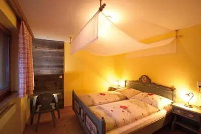 Ein Bett oder Betten in einem Zimmer der Unterkunft Alps Villa