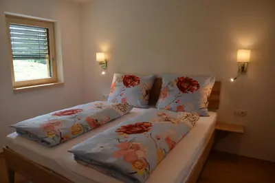 Ein Bett oder Betten in einem Zimmer der Unterkunft Ferienwohnung Grunholz