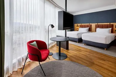Ein Bett oder Betten in einem Zimmer der Unterkunft Four Points by Sheraton Panoramahaus Dornbirn