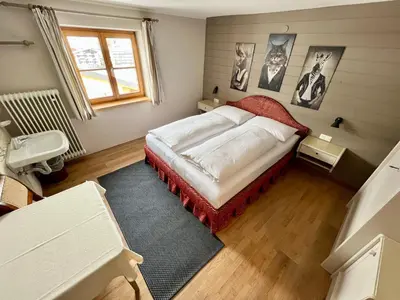 Ein Bett oder Betten in einem Zimmer der Unterkunft Lech Hostel