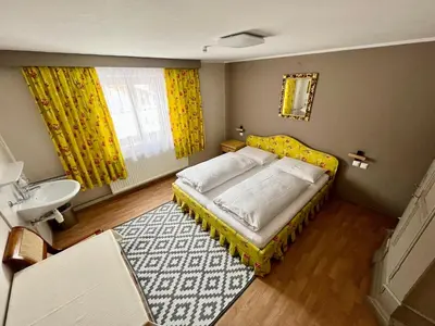 Ein Bett oder Betten in einem Zimmer der Unterkunft Lech Hostel