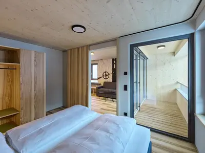 Ein Bett oder Betten in einem Zimmer der Unterkunft DER*ADLER Apartments