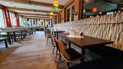 Ein Restaurant oder anderes Speiselokal in der Unterkunft ALPSTADT LIFESTYLE Hotel