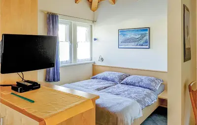 Ein Bett oder Betten in einem Zimmer der Unterkunft Ferienwohnung Braz-Klostertal