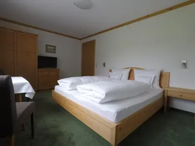 Ein Bett oder Betten in einem Zimmer der Unterkunft Ferienhaus Bergland