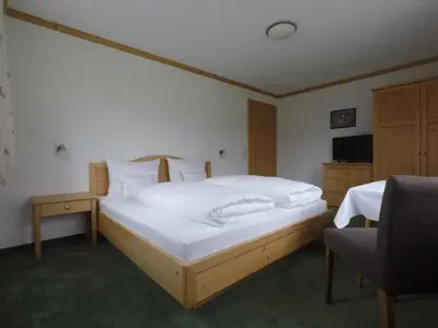 Ein Bett oder Betten in einem Zimmer der Unterkunft Ferienhaus Bergland