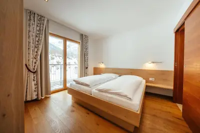 Ein Bett oder Betten in einem Zimmer der Unterkunft Landhaus Valfontana