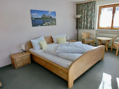 Ein Bett oder Betten in einem Zimmer der Unterkunft Haus Kristall Ferienwohnungen
