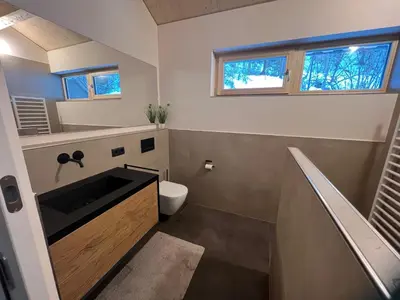 Ein Badezimmer in der Unterkunft River Lodge