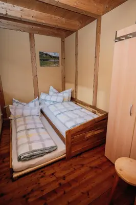 Ein Bett oder Betten in einem Zimmer der Unterkunft Ferienhaus FuchsbAu