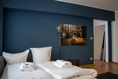 Ein Bett oder Betten in einem Zimmer der Unterkunft Stylische Stadt-Wohnung Bregenz - mit Parkplatz