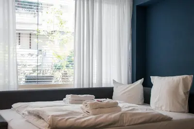Ein Bett oder Betten in einem Zimmer der Unterkunft Stylische Stadt-Wohnung Bregenz - mit Parkplatz