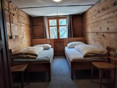 Ein Bett oder Betten in einem Zimmer der Unterkunft Pfefferhütte