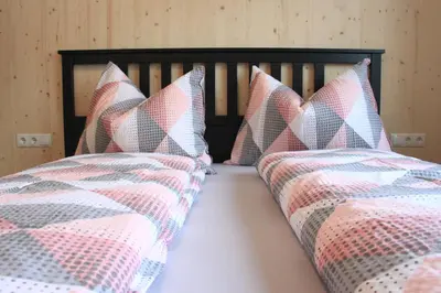 Ein Bett oder Betten in einem Zimmer der Unterkunft Bergreich Appartement 1