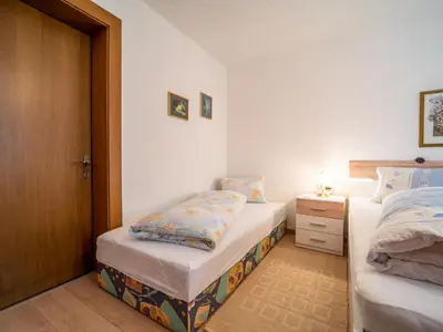 Ein Bett oder Betten in einem Zimmer der Unterkunft Apartment Claudia