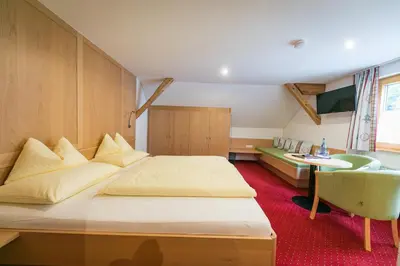 Ein Bett oder Betten in einem Zimmer der Unterkunft Café Pension zum Jäger