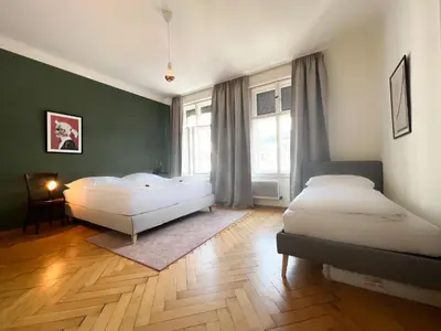 Ein Bett oder Betten in einem Zimmer der Unterkunft Stadtjuwel mit Pfänderblick