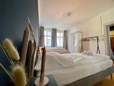 Ein Bett oder Betten in einem Zimmer der Unterkunft Stadtjuwel mit Pfänderblick