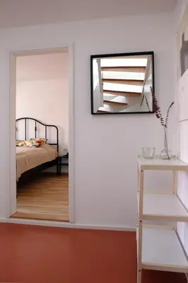 Ein Bett oder Betten in einem Zimmer der Unterkunft Bright + Cozy Dachgeschoß Maisonette im Zentrum