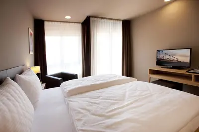 Ein Bett oder Betten in einem Zimmer der Unterkunft Hotel am Garnmarkt