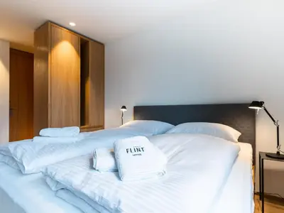 Ein Bett oder Betten in einem Zimmer der Unterkunft Das Flint