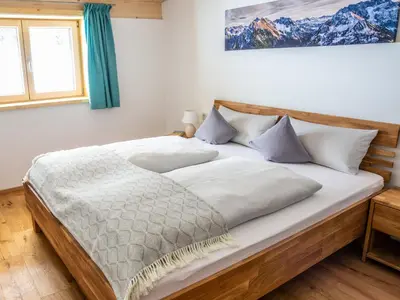 Ein Bett oder Betten in einem Zimmer der Unterkunft Ferienwohnung Schwendle Egg