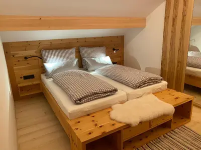Ein Bett oder Betten in einem Zimmer der Unterkunft Dahoam - neue Ferienwohnung mit Kamin und Sauna