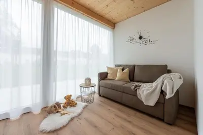 Ein Sitzbereich in der Unterkunft Ländleapartments