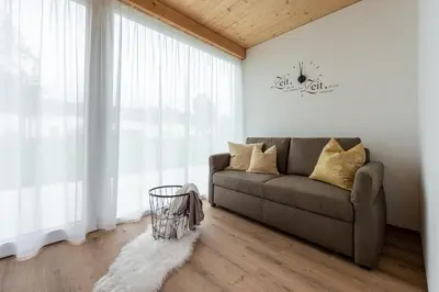 Ein Sitzbereich in der Unterkunft Ländleapartments