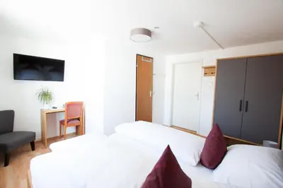 Ein Bett oder Betten in einem Zimmer der Unterkunft Wellenhof Bodensee