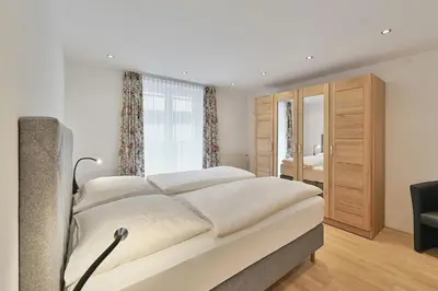 Ein Bett oder Betten in einem Zimmer der Unterkunft Apartmenthaus Steiner
