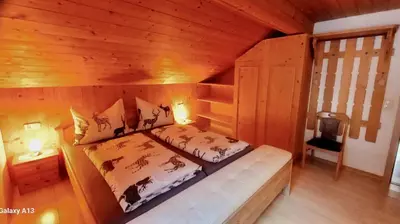 Ein Bett oder Betten in einem Zimmer der Unterkunft Haus Simma