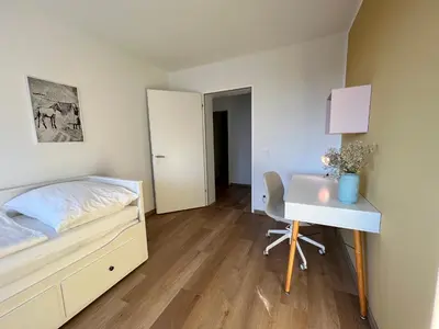 Ein Bett oder Betten in einem Zimmer der Unterkunft Apartment Popular