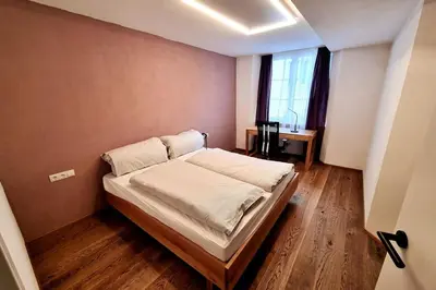 Ein Bett oder Betten in einem Zimmer der Unterkunft Appartment Wolf Huber im Zentrum der Altstadt.