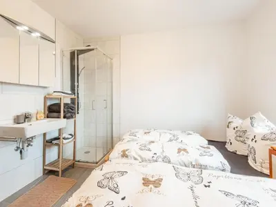 Ein Bett oder Betten in einem Zimmer der Unterkunft Ferienhaus Feldkirch mit Aussicht