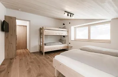 Ein Bett oder Betten in einem Zimmer der Unterkunft Ferienhaus Schihütte Mellau