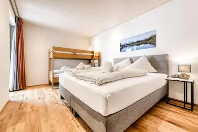 Ein Bett oder Betten in einem Zimmer der Unterkunft Familienferienwohnung Zentral by A-Appartments