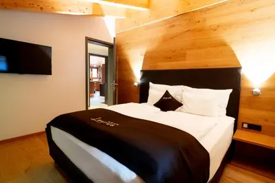 Ein Bett oder Betten in einem Zimmer der Unterkunft Apart-Hotel Laurus Lech
