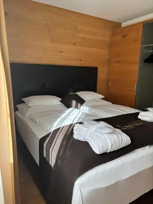 Ein Bett oder Betten in einem Zimmer der Unterkunft Apart-Hotel Laurus Lech