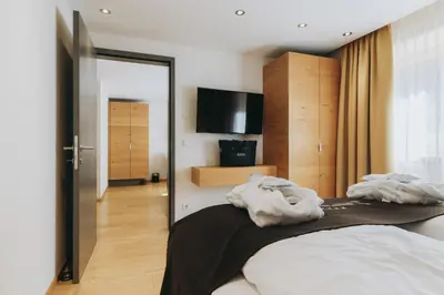 Ein Bett oder Betten in einem Zimmer der Unterkunft Apart-Hotel Laurus Lech