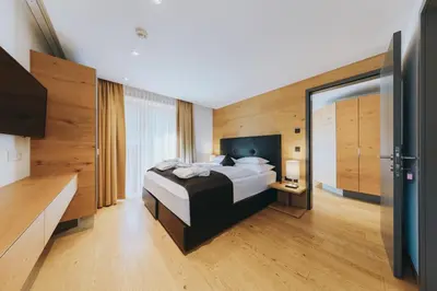 Ein Bett oder Betten in einem Zimmer der Unterkunft Apart-Hotel Laurus Lech