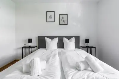 Ein Bett oder Betten in einem Zimmer der Unterkunft homy Central City Oasis in Dornbirn