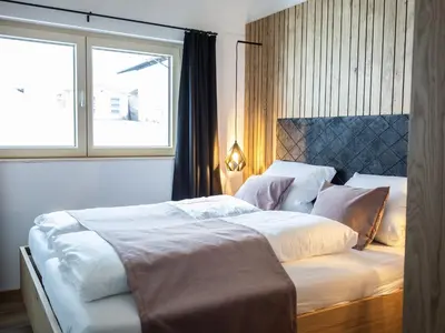 Ein Bett oder Betten in einem Zimmer der Unterkunft Kracha Alpinlodge