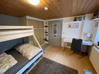 Ein Bett oder Betten in einem Zimmer der Unterkunft Kiwi Ferienwohnung